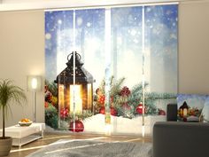 a living room with christmas decorations on the wall and window curtains in front of it