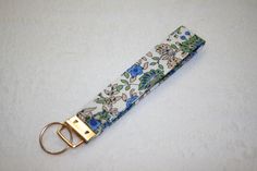 a keychain with a flower print on it