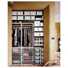 an organized closet with clothes and baskets