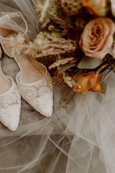 the bride's wedding shoes and bouquet are on display