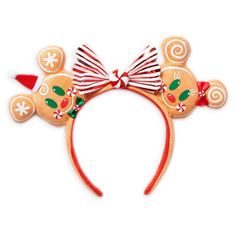 a close up of a minnie mouse headband with candy canes on the ears