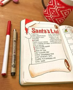 an open notebook sitting on top of a wooden table