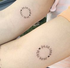 two people with matching tattoos on their legs, one has the word love written in small letters