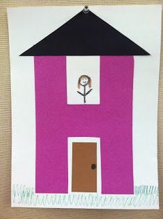 a paper cut out of a house with a tree on the roof and a door