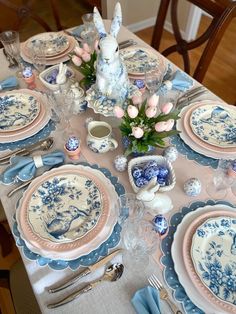 the table is set with blue and white china