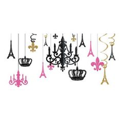 a chandelier with pink and black decorations hanging from it's sides in front of the eiffel tower