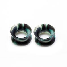 two black and white rings sitting next to each other