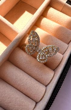 Elevate your style with our stunning 14-karat gold-plated butterfly ring, adorned with sparkling cubic zirconia stones. This elegant piece is designed for those who love a mix of dainty and fashionable jewelry. Perfect for adding a touch of nature-inspired beauty to your look, this ring is versatile enough for everyday wear or special occasions. Its affordable luxury makes it a great gift for loved ones or a trendy addition to your own jewelry collection. Shop now to enjoy a blend of elegance and affordability! Follow us on instagram @jewelrybyana for more trending jewelry ideas. Butterfly Cubic Zirconia Wedding Rings, Butterfly-shaped Cubic Zirconia Wedding Rings, Elegant Cubic Zirconia Butterfly Ring, Elegant Butterfly Diamond Ring For Gift, Butterfly Ring With Cubic Zirconia As A Gift, Diamond Butterfly Ring In Yellow Gold, Gold Cubic Zirconia Butterfly Ring For Gift, Gold Cubic Zirconia Butterfly Ring As Gift, Butterfly-shaped Cubic Zirconia Rings As Gifts