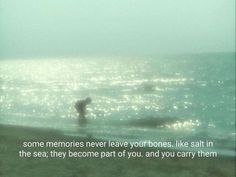 two people are in the ocean on a foggy day with a quote written below