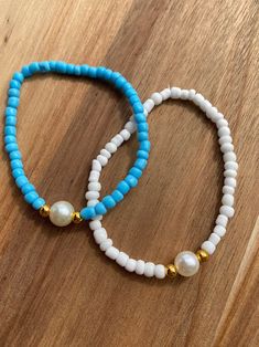 Comes in blue or white please message once you order with the color you want  Clay bead bracelet Approximately 6.5 inches long  Elastic band.  My shop has other designs as well!! Please visit my Instagram  emr_smileybeads Please message me if you have any questions or need a bigger quantity!  thank you for supporting my small business! Small Beads Bracelets Ideas Aesthetic, Clay Bead Bracelet Aesthetic, Clay Bead Bracelet Ideas With Pearls, Bracelet Ideas Small Beads, Bracelet Color Combos Beads, Sea Bead Bracelets Ideas, Breclate Design, Sea Bead Bracelets