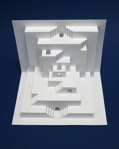 a paper model of a building with stairs