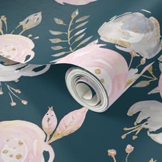 a blue and pink floral wallpaper with gold foiling on the bottom half of it