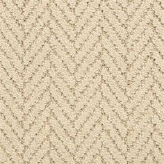 an up close view of a beige carpet with small, wavy lines on the side