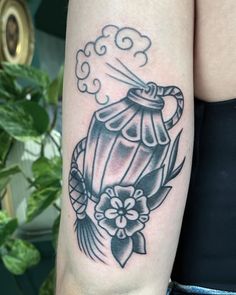 a woman's arm with a hot air balloon tattoo on it