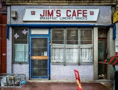 a building with a sign that says jimmy's cafe and breakfast lunches snacks