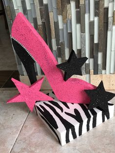 a zebra print box with pink and black glitter high heels