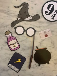 some harry potter themed items are on a table with the number 9 in it's center