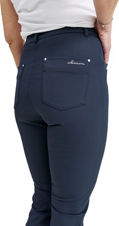 Elite high waist capri pant is made of a soft functional material in a 4-way stretch that is also very breathable. The fabric has drycool and wicking effects. Front zipper, two front, and two back pockets give room for the necessities. The right back pocket also has silicon tape to keep the scorecard in place. The ladies' stretch capri pants' belt loops around the waist allow a belt. Feminine fit that works just as well on course as off course. Elite stretch capri trousers are so comfortable tha Blue Stretch Bottoms With Functional Pockets, Navy Stretch Functional Bottoms, Functional Navy Bottoms With 4-way Stretch, Sporty Navy Elastane Bottoms, Silicone Tape, Capri Trousers, Sports Wear, Dress Pant, Mens Activewear