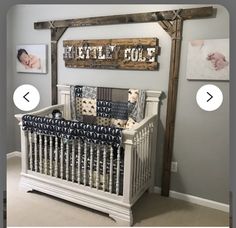 a baby crib in the middle of a room with pictures on the wall above it