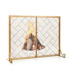 a fireplace screen with a fire burning in it