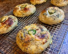 several rolls on a cooling rack with seasoning sprinkles