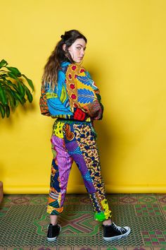 "African Trousers, Festival Pants, Patchwork Pants An Ashanti firm favourite, these Colour Me Crazy unisex patchwork trousers are made from recycled 100% cotton wax print patchwork material that makes each pair original! Our colourful trousers are really comfy, have a slim fit and look great on guys and girls! Pair them up with our Colour Me Crazy patchwork bomber jacket or hoodie for a great festival outfit!  - Crazy colorful pants - Slim leg - Unisex - Elasticated waistband with drawstring for Festival Trousers, Crazy Pants, Pants Colorful, African Print Pants, Patchwork Trousers, Aztec Jacket, African Print Shirt, Ankara Clothing, Patchwork Pants