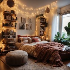 a bedroom with lights strung from the ceiling and a bed in front of a window