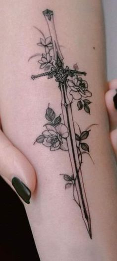 a woman's thigh with a flower tattoo on it