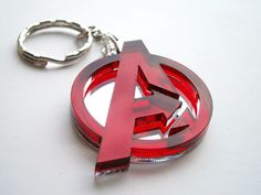 a red metal keychain with the letter a on it's center circle