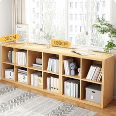 the bookshelf is next to a window with two signs on it that read 30cm and 130cm