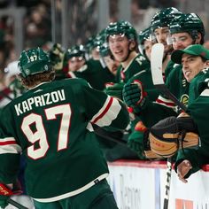 the hockey players are celebrating on the ice