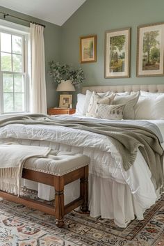 a large bed sitting in a bedroom next to a window