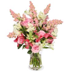 a vase filled with pink and white flowers