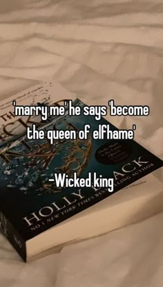 a book sitting on top of a bed next to a white sheet with the words marry me he says'become the queen of elfhame