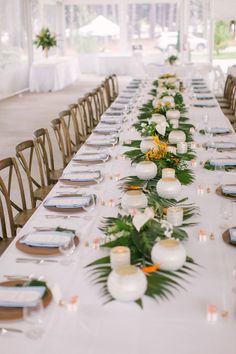 a long table is set with candles and flowers