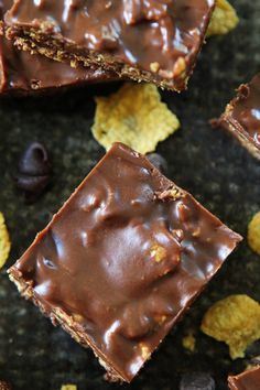 chocolate and peanut butter crackers are arranged on a granite surface with chips scattered around them