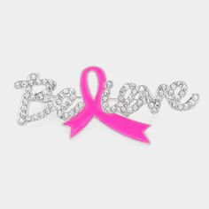 a pink ribbon with the word breast on it and diamond bling in the middle