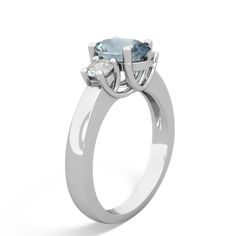 This 14K White Gold trellis three stone ring features an {shape} icy blue aquamarine, flanked by {diamondcarats}. A trellis ring features gorgeous interwoven prongs holding the aquamarines that symbolize the union of marriage and the wonderful journey you two will embark on together for the rest of your lives. Three Stone Oval Engagement Ring With Aquamarine, Luxury Peridot Three-stone Rings, Trellis Ring, Three Stone Ring, Aquamarine Jewelry, Icy Blue, Aqua Marine, Aquamarine Rings, Clear White