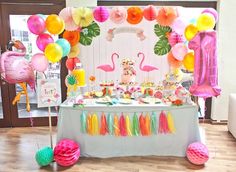 an image of a party with flamingos on the table