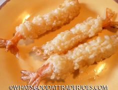 two pieces of fried food on a yellow plate