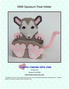 an origami mouse with pink paws and hearts on it's chest is shown