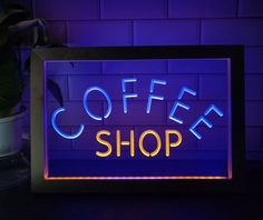 a neon sign that says coffee shop on it