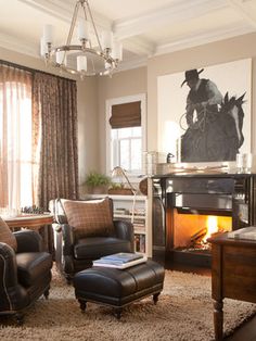 a living room filled with furniture and a fire place in the middle of the room