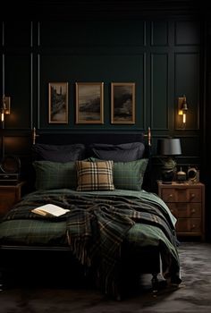 a bedroom with dark green walls and plaid bedspread, black comforter, gold framed pictures on the wall