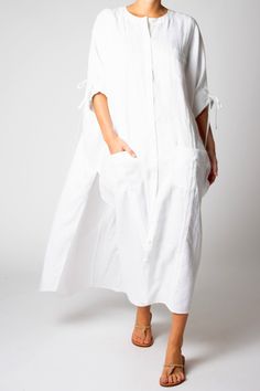 100% Linen Color: Pure White Removable belt Center front button closure Hand Wash Imported Think of our new, whispery washed-linen Paisley as the go-anywhere and do-anything dress. It's inspired by our famously oversized guayabera dresses, but this effortless silhouette can be worn unbelted like a caftan for a day at the beach or belted for brunch or a day of shopping. One size truly fits all, and all situations. Guayabera Dress, Linen Color, Linen Dress, Pure White, Summer Sale, Paisley, Shirt Dress, Hand Wash, Pure Products