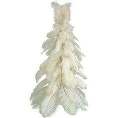 a white feather tree hanging on a wall