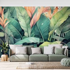 a living room with a couch and large wall mural in the background, featuring tropical leaves