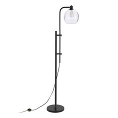 a black floor lamp with a glass globe shade