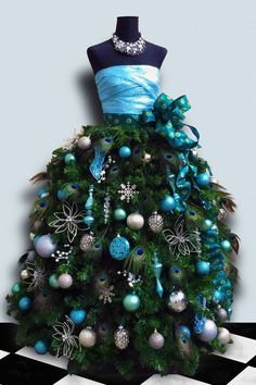 a blue and green christmas tree with ornaments on it