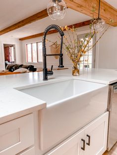 a kitchen with a sink, dishwasher and counter top in it's center